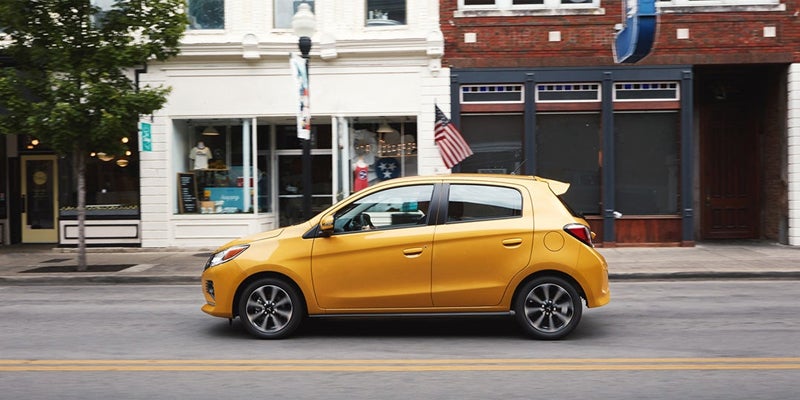 A Yellow Mirage Car running on city road